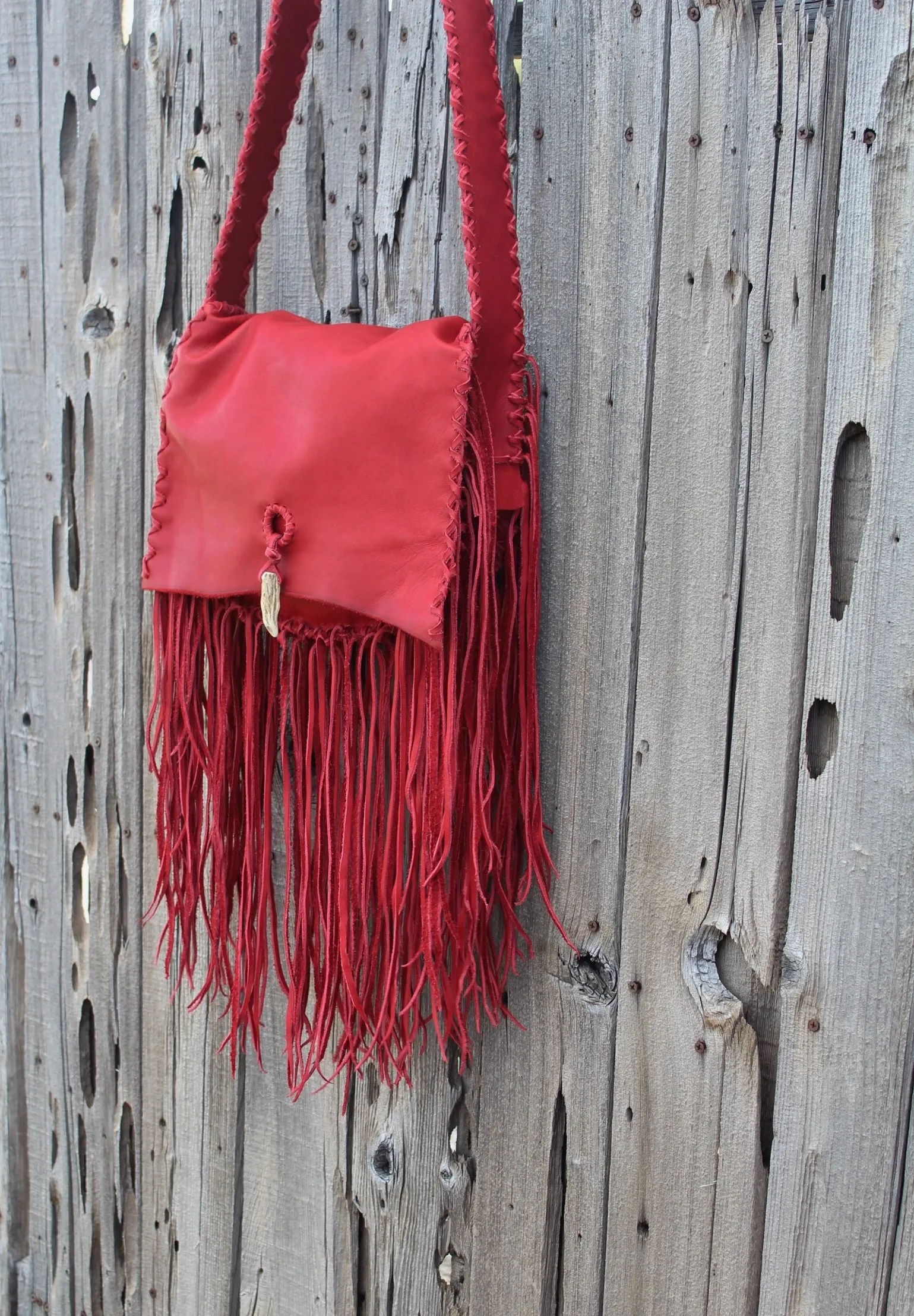 Fringed red leather handbag, soft leather bag