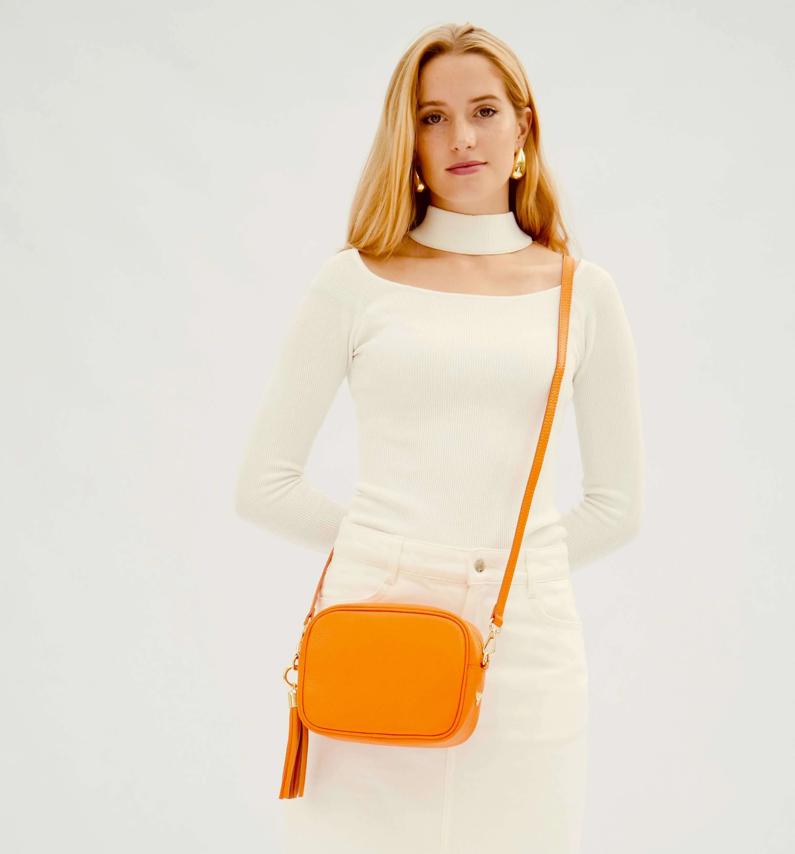 The Tassel Orange Leather Crossbody Bag With Gold Chain Strap