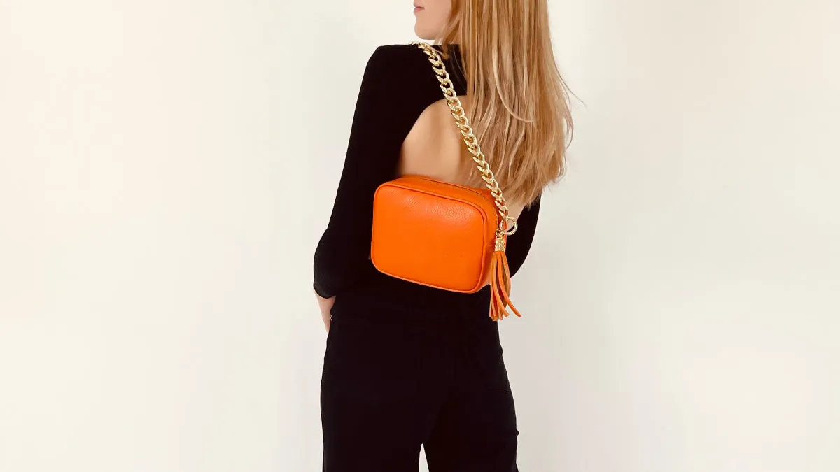 The Tassel Orange Leather Crossbody Bag With Gold Chain Strap