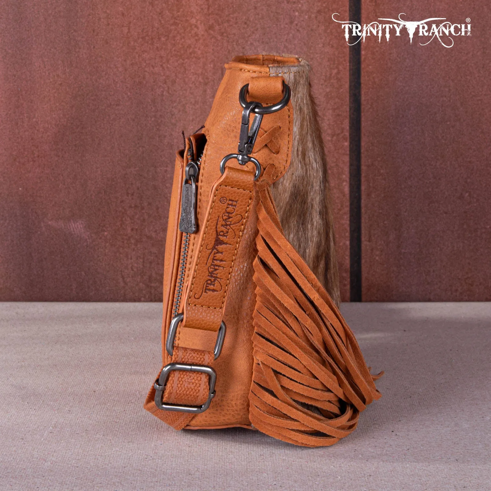 TR159G-9360   Trinity Ranch Hair-On Cowhide/Tooled Fringe Concealed Carry Crossbody Bag