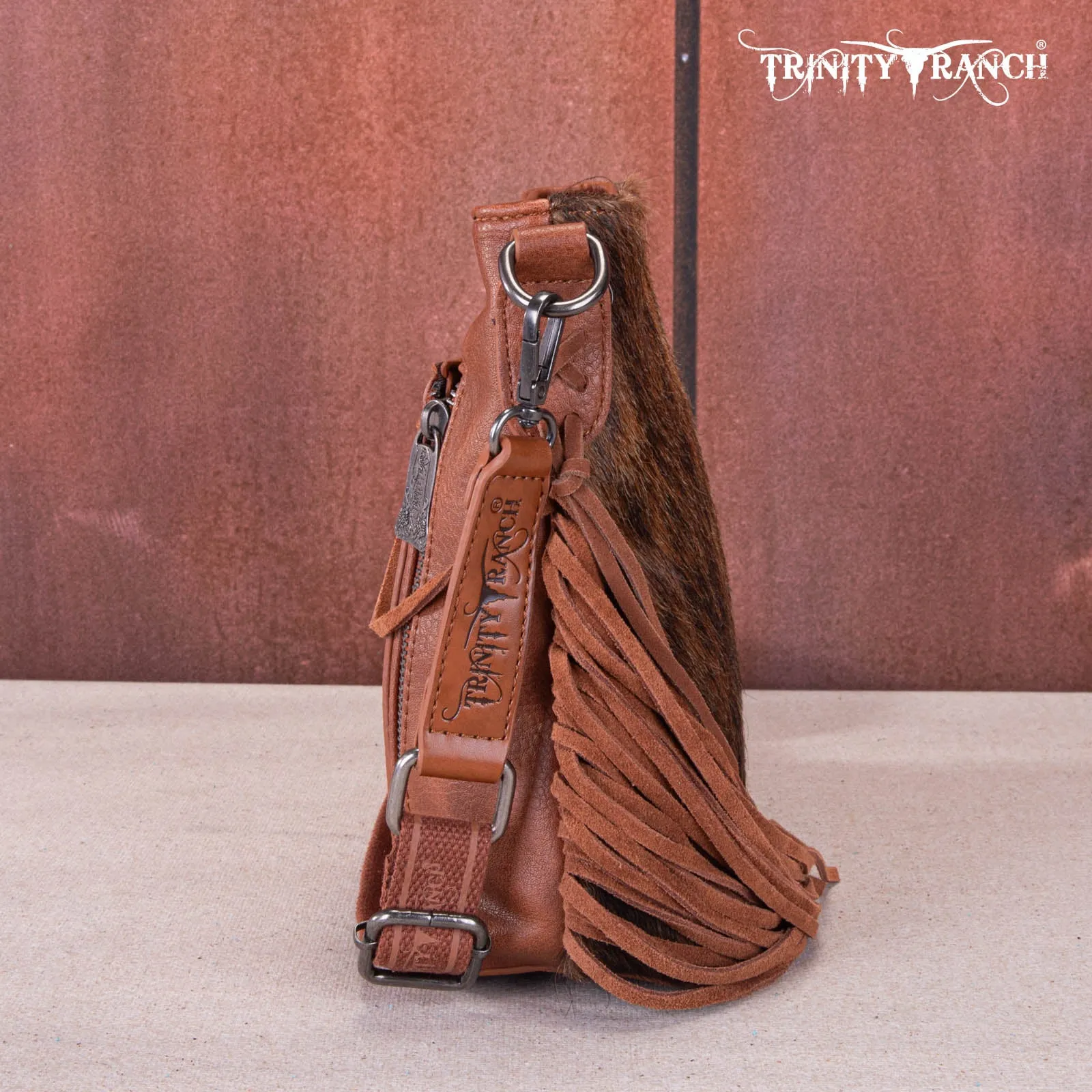 TR159G-9360   Trinity Ranch Hair-On Cowhide/Tooled Fringe Concealed Carry Crossbody Bag